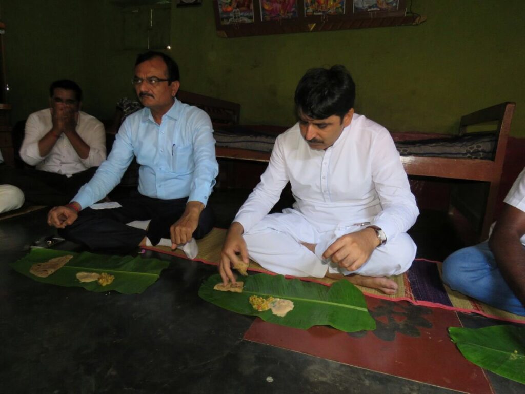 Gujarat Assembly Speaker Shankar Chaudhary eating traditional food during a visit
